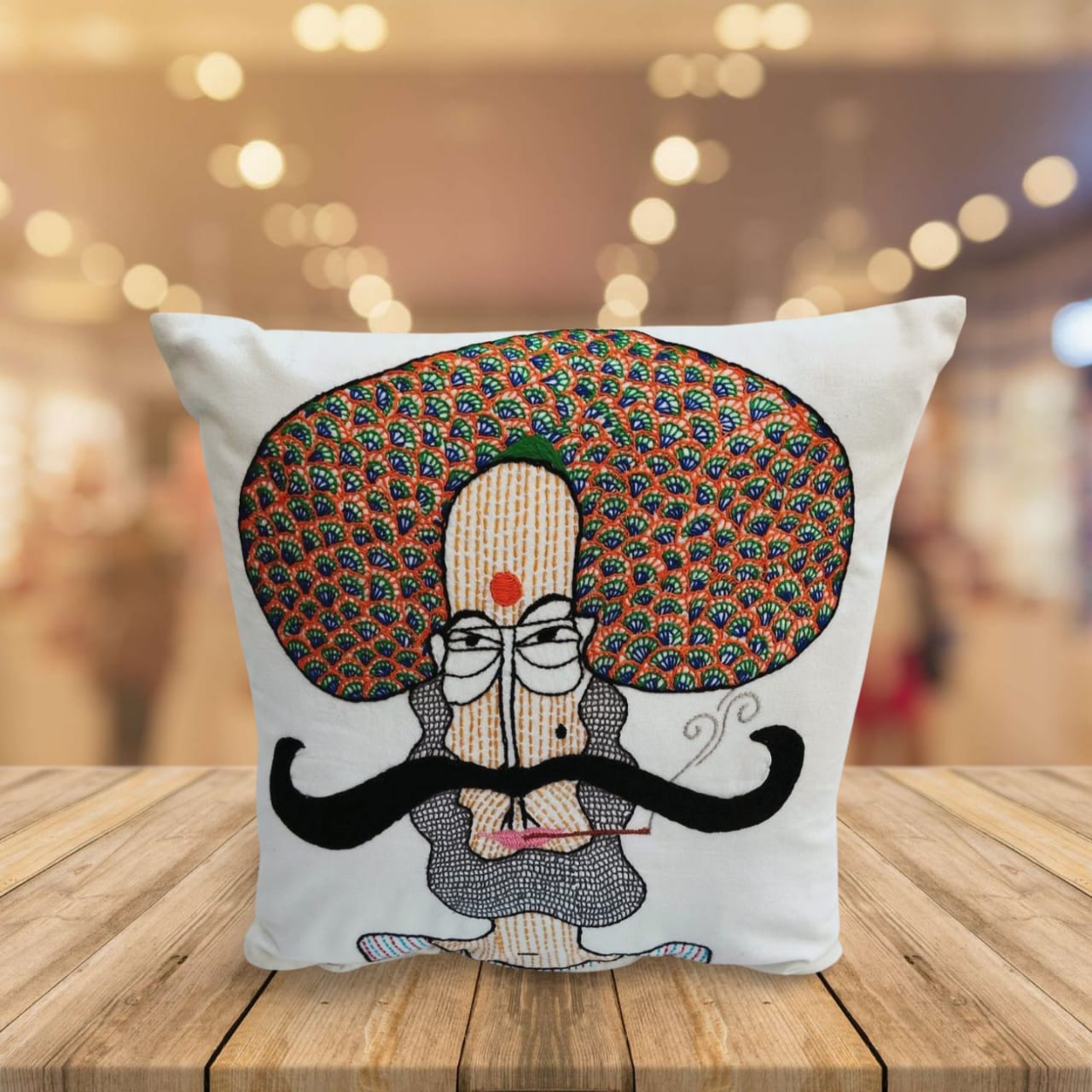 Hand embroidered cushion cover of a moustache man . The design is inpsired from Gond Art.