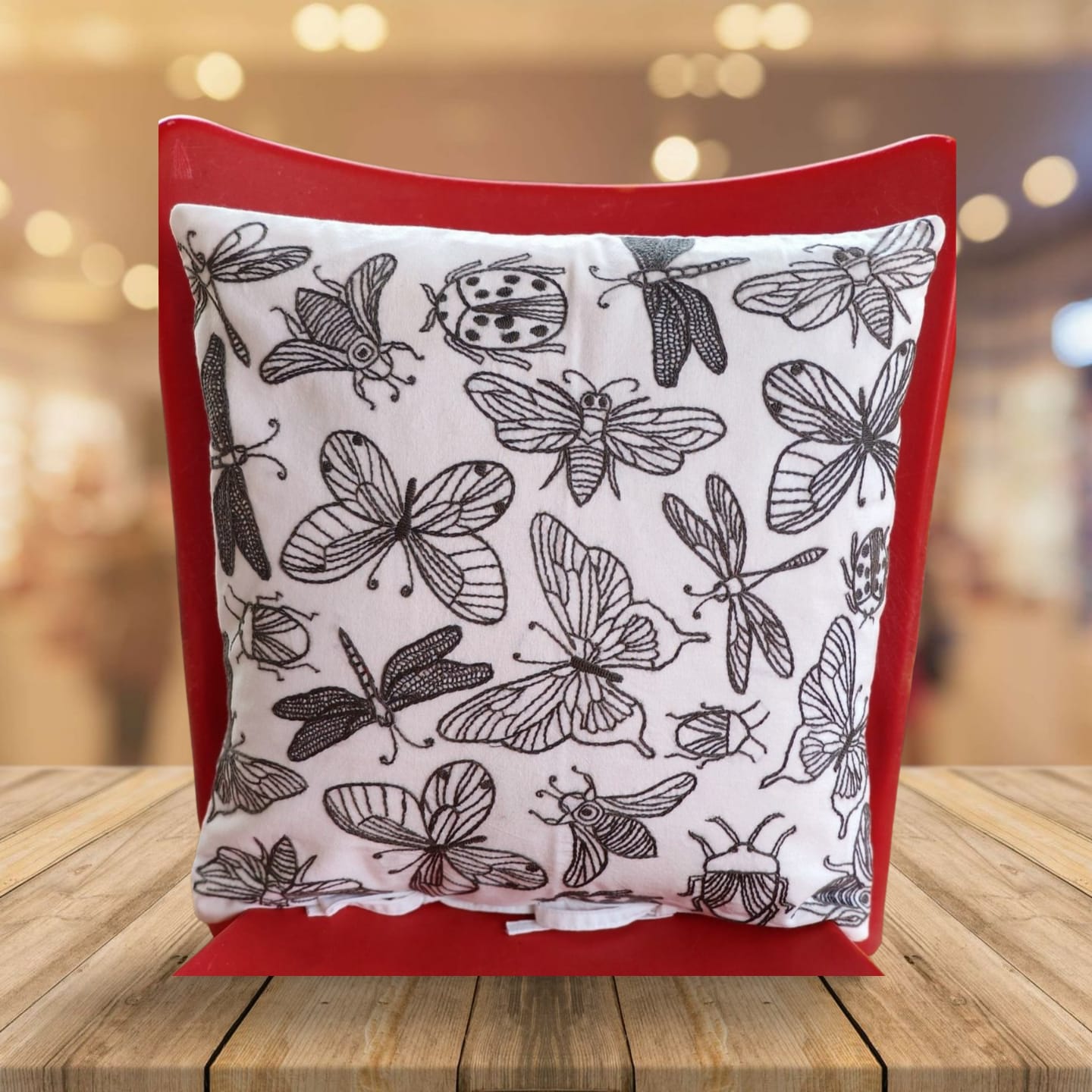 Hand embroidered cushion cover