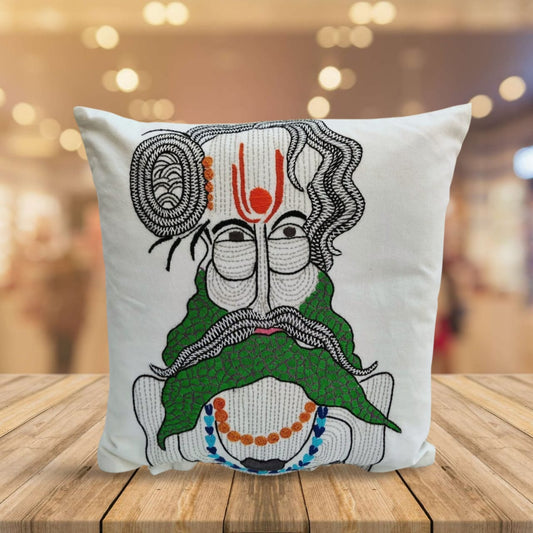 Decorative pillow with a face design inspired from Gond Art.