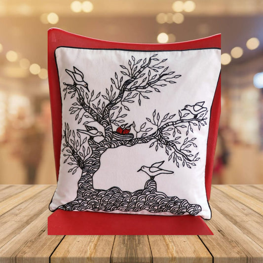 Decorative pillow with tree and bird design inspired from Gond Art.