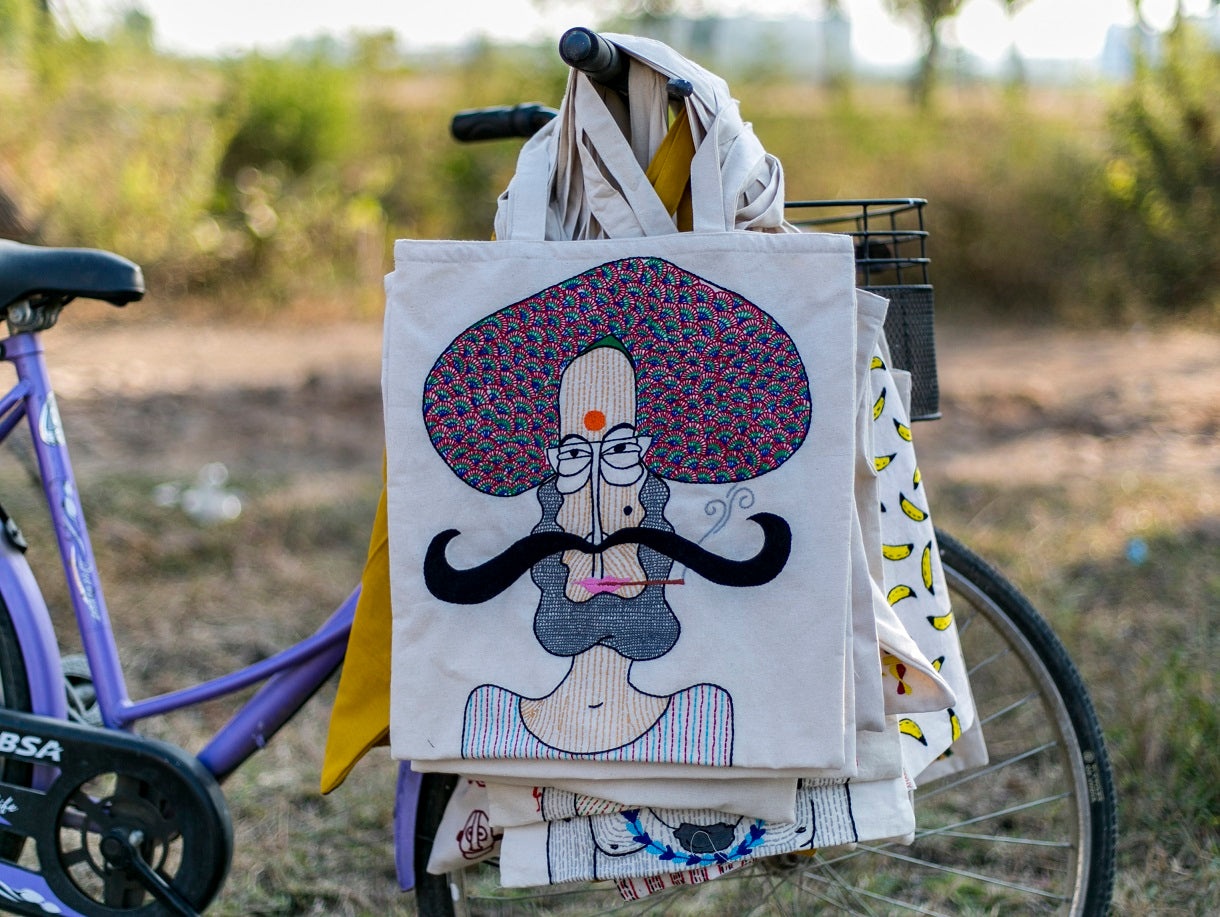 Hand embroidered tote bag with the image of a Kisan ( Farmer ) . Made by women artisans.