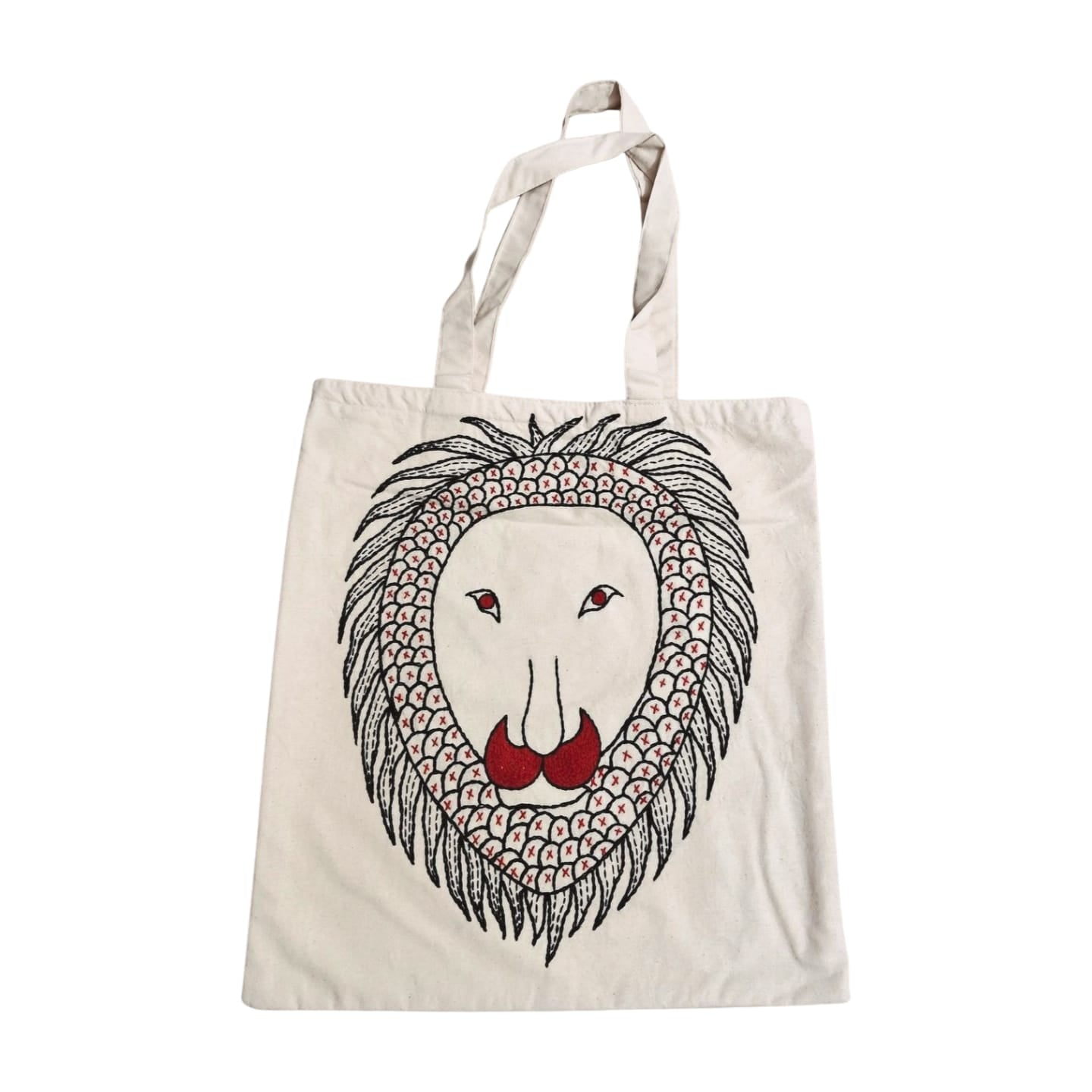 Tote bag with a lion's face design on a off white background inspred from Gond Art.