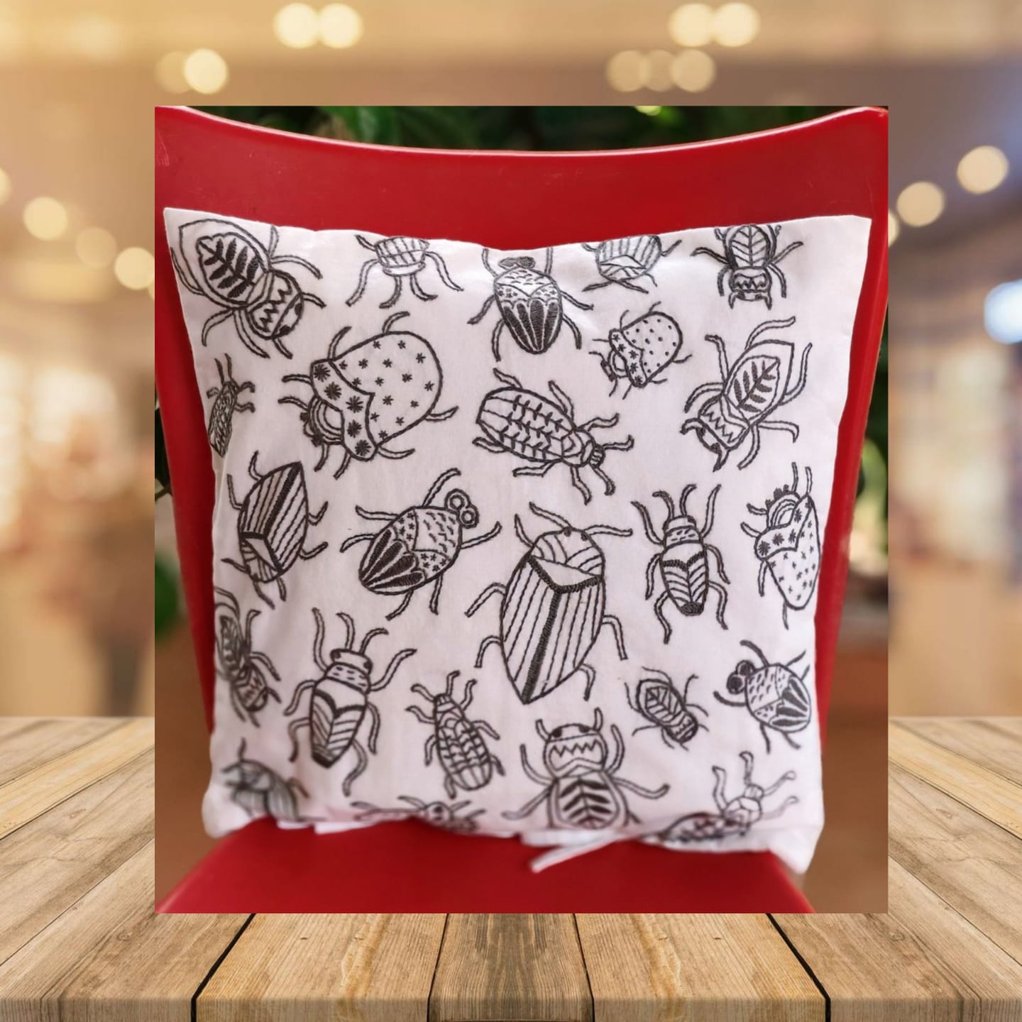 Hand embroidered cushion cover